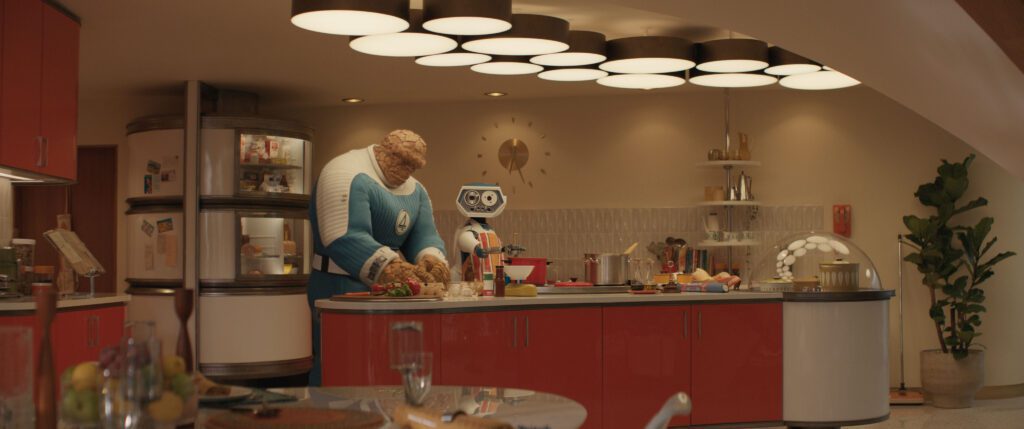 (L-R) Ebon Moss-Bachrach as Ben Grimm/The Thing and H.E.R.B.I.E in 20th Century Studios/Marvel Studios' FANTASTIC FOUR: FIRST STEPS. Photo courtesy of 20th Century Studios/Marvel Studios. © 2025 20th Century Studios / © and ™ 2025 MARVEL.